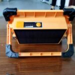Import Portable led flood light with solar panel from chinese wholesale supplier and manufacturer